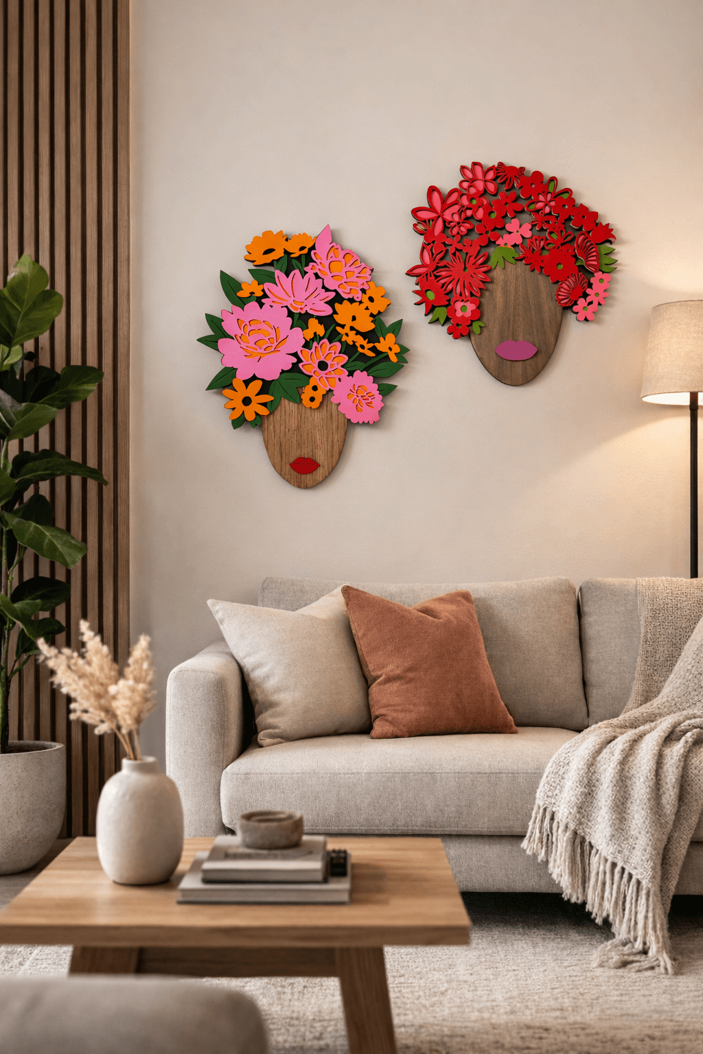 Decorative wall art with floral designs above a sofa in a living room.