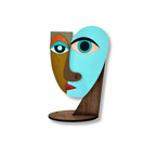 A colorful abstract sculpture of two stylized faces mounted on a wooden stand, photographed against a plain white background.